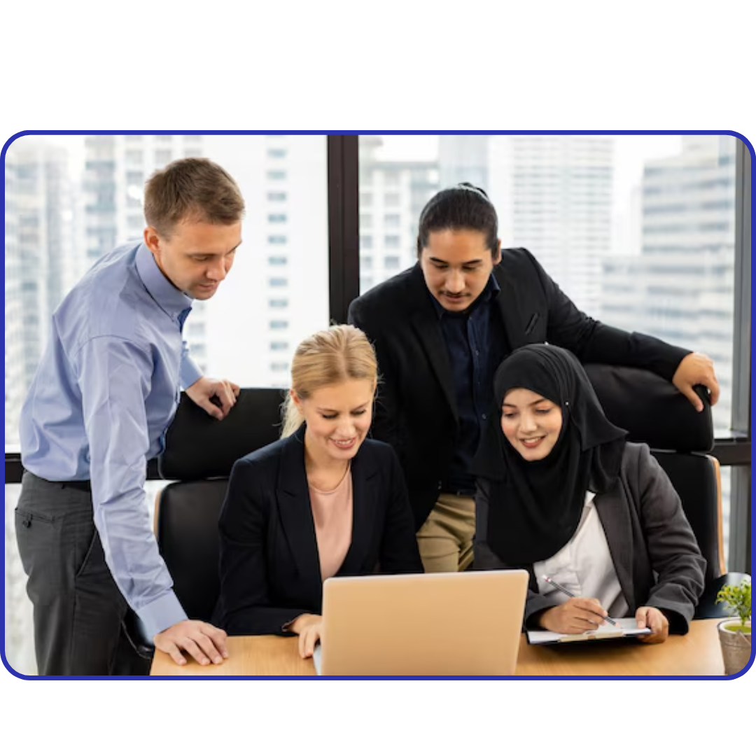 AquireTech team working in modern office on Shopify store design and development projects